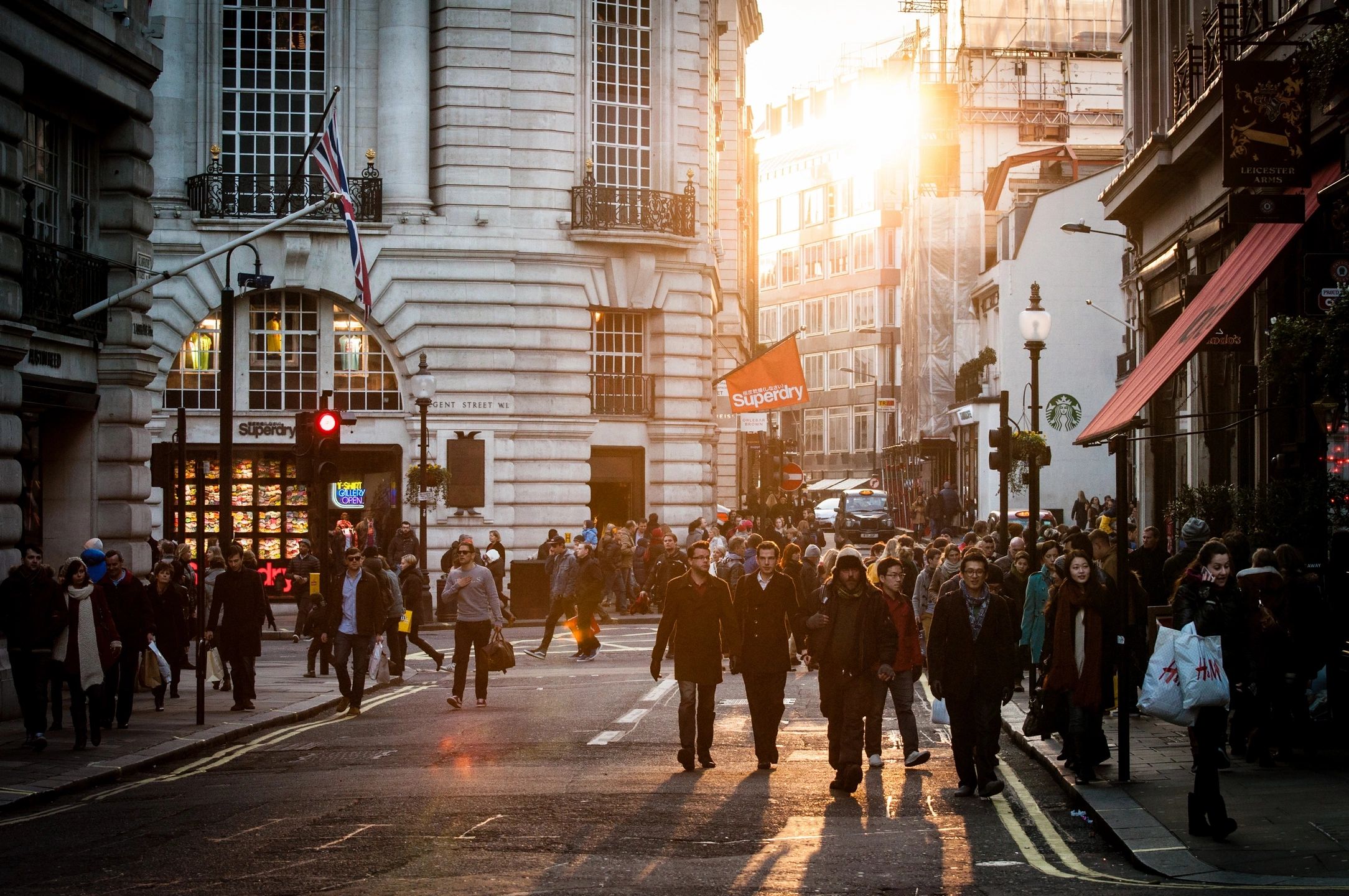 People walking on a city street, representing real clients facing legal fee questions.